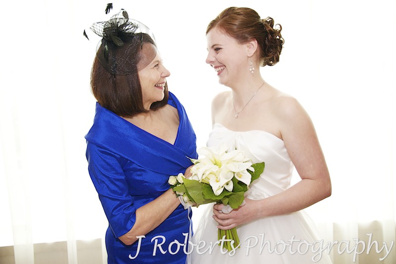 Bride laughing with her mother before wedding - wedding photography sydney